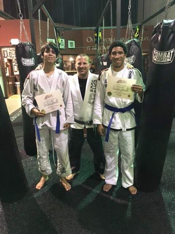 These two young adults are growing up!! BLUE BELTS!!!